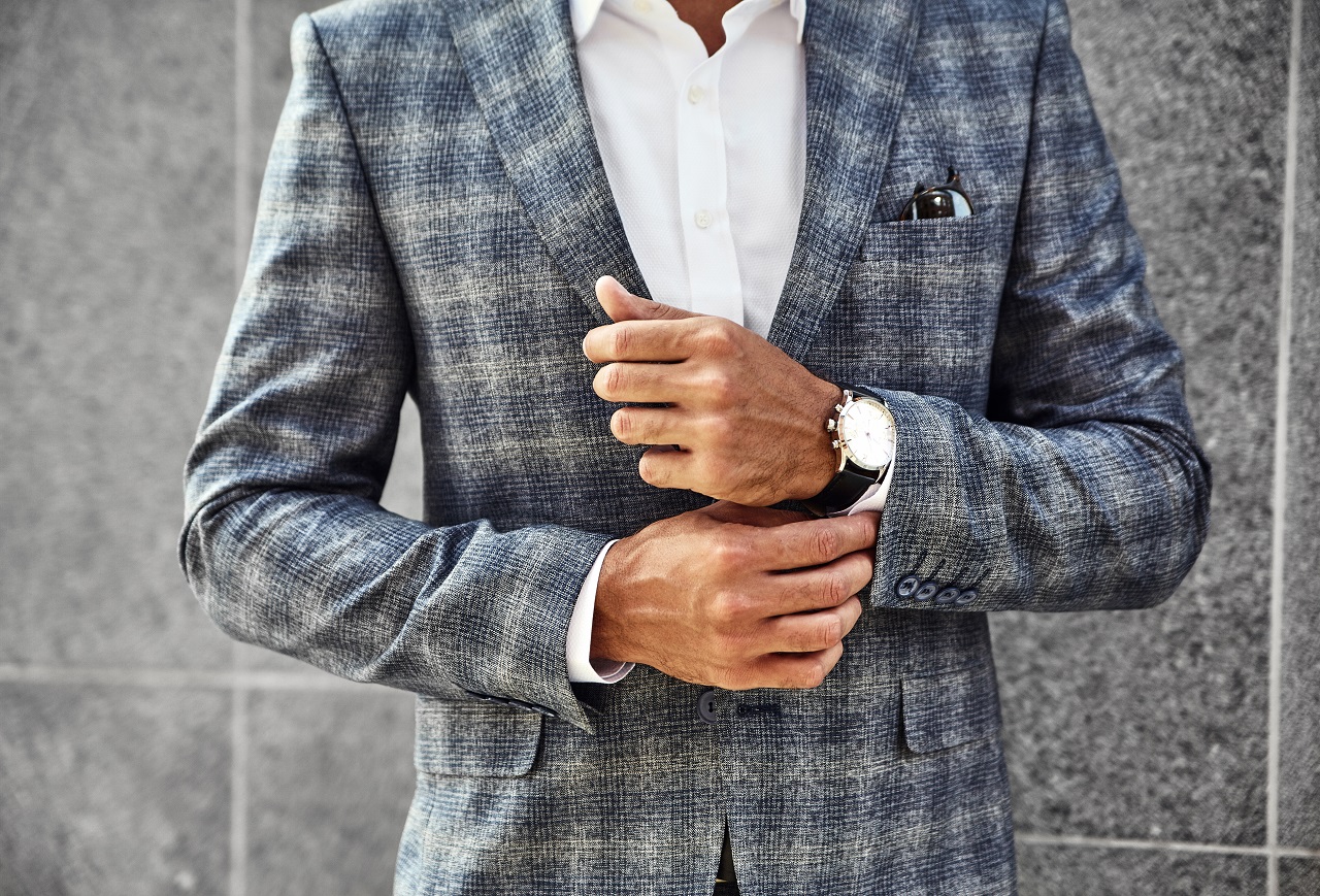 businessman model dressed in elegant checkered suit