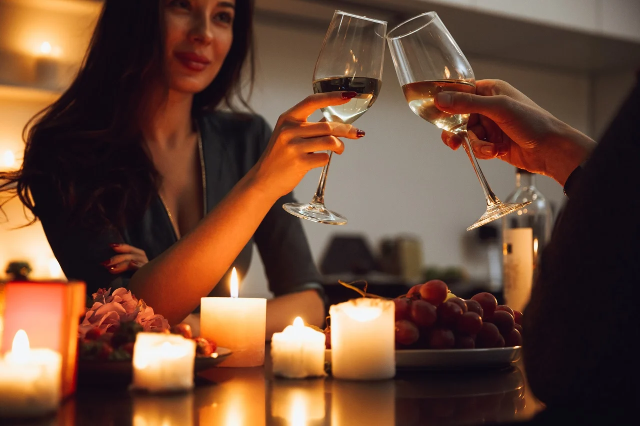 couple having a romantic candlelight dinner at home