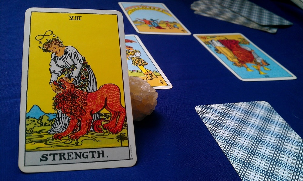 The Strength Tarot Card Meaning – Major Arcana XI