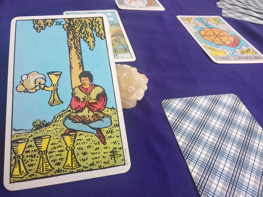 The (4) Four of Cups Tarot Card Meaning – Minor Arcana