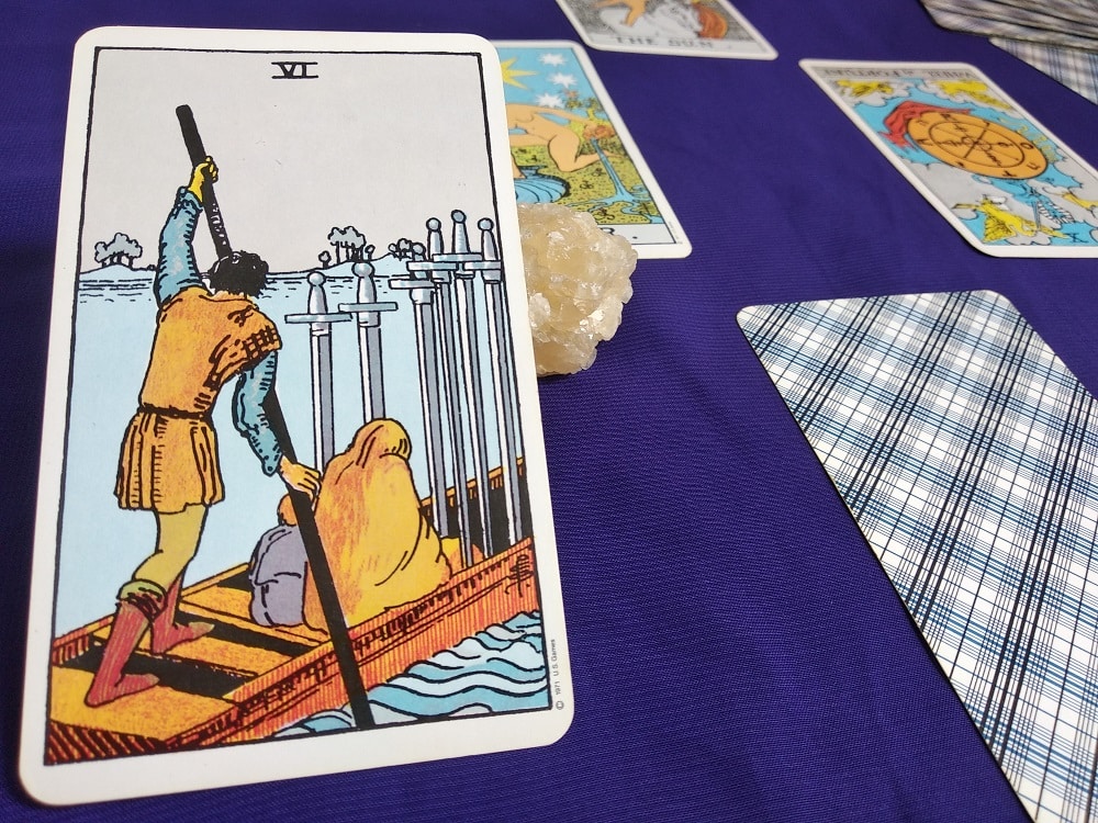 The Six of Swords Tarot Card Meaning Upright and Reversed