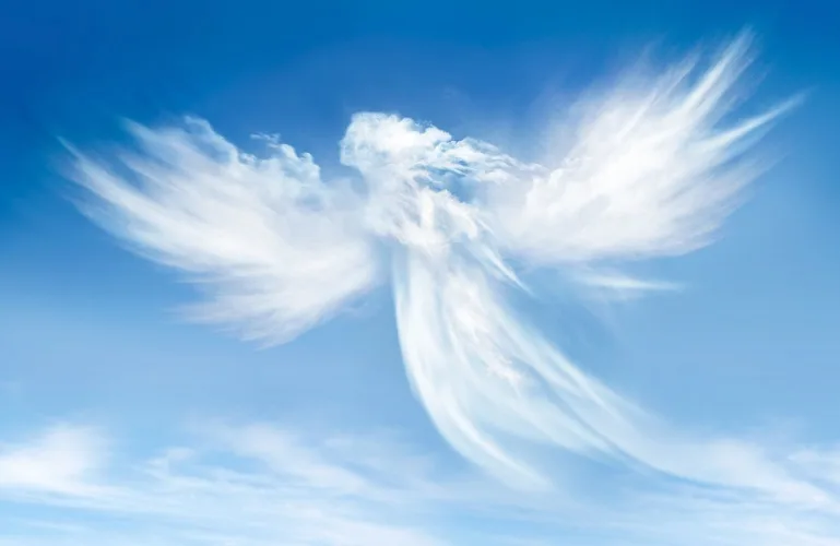 Clouds in the form of an angel set against a blue sky