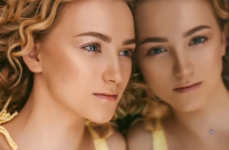 Twin blonde sisters representing the Gemini zodiac sign